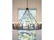 Round, black chandelier with many candle-style lights at 2420 Floyd St, Sarasota, FL 34239