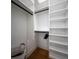 Spacious walk-in closet with ample shelving and hanging space at 2420 Floyd St, Sarasota, FL 34239