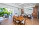 Modern dining room with wood table, and sliding doors opening to the outside patio at 2420 Floyd St, Sarasota, FL 34239