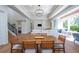 Bright dining room with wood table and access to backyard patio at 2420 Floyd St, Sarasota, FL 34239