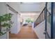 Bright and spacious entryway with hardwood floors, a sliding barn door, and a modern staircase at 2420 Floyd St, Sarasota, FL 34239
