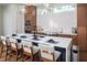 Modern kitchen with a large island and stylish light fixtures at 2420 Floyd St, Sarasota, FL 34239