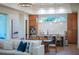 Open concept kitchen and living area with a large island and hardwood floors at 2420 Floyd St, Sarasota, FL 34239