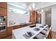 Modern kitchen with island, white quartz countertop, and blue tile backsplash at 2420 Floyd St, Sarasota, FL 34239