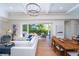 Light and airy living room with an open floor plan, and sliding doors leading to the outdoors at 2420 Floyd St, Sarasota, FL 34239