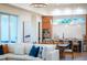 Open concept living room and kitchen with modern decor and hardwood floors at 2420 Floyd St, Sarasota, FL 34239