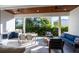 Outdoor kitchen with stainless steel appliances and blue cabinetry at 2420 Floyd St, Sarasota, FL 34239