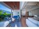 Covered patio features outdoor seating, a grill, and a wood ceiling at 2420 Floyd St, Sarasota, FL 34239