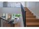 Modern staircase with black metal railing and light wood steps at 2420 Floyd St, Sarasota, FL 34239