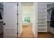 Large walk-in closet with ample shelving and hanging space at 2420 Floyd St, Sarasota, FL 34239