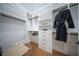 Spacious walk-in closet with built-in shelves and drawers at 2420 Floyd St, Sarasota, FL 34239