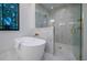 Relaxing bathroom with free-standing tub and marble shower at 2440 Floyd St, Sarasota, FL 34239