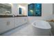 Large bathroom with soaking tub, walk-in shower, and double vanity at 2440 Floyd St, Sarasota, FL 34239