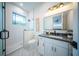 Modern bathroom with a walk-in shower, freestanding bathtub, and sleek vanity at 2440 Floyd St, Sarasota, FL 34239