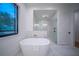 Spa-like bathroom with soaking tub and walk-in shower at 2440 Floyd St, Sarasota, FL 34239