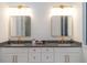 Modern bathroom featuring double vanity and gold fixtures at 2440 Floyd St, Sarasota, FL 34239