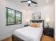 Bright bedroom with hardwood floors and ceiling fan at 2440 Floyd St, Sarasota, FL 34239