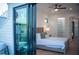 Bedroom with private balcony access and view of the backyard at 2440 Floyd St, Sarasota, FL 34239