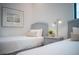 Two twin beds in a bedroom with hardwood floors and natural light at 2440 Floyd St, Sarasota, FL 34239