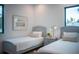 Two twin beds in a bedroom with hardwood floors and natural light at 2440 Floyd St, Sarasota, FL 34239