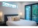 Bright bedroom with a private balcony and natural light at 2440 Floyd St, Sarasota, FL 34239