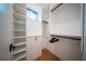 Large walk-in closet with ample shelving and hanging space at 2440 Floyd St, Sarasota, FL 34239