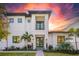 Modern two-story home with a white exterior and dark accents at 2440 Floyd St, Sarasota, FL 34239