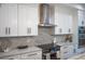 Modern kitchen with white cabinets, quartz countertops, and stainless steel appliances at 2440 Floyd St, Sarasota, FL 34239