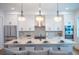 Modern kitchen with island, stainless steel appliances, and hardwood floors at 2440 Floyd St, Sarasota, FL 34239