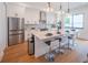 Modern kitchen with stainless steel appliances and large island at 2440 Floyd St, Sarasota, FL 34239