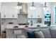 Modern kitchen with island, stainless steel appliances, and hardwood floors at 2440 Floyd St, Sarasota, FL 34239