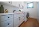 Clean laundry room with white cabinets and countertop space at 2440 Floyd St, Sarasota, FL 34239