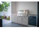 Modern outdoor kitchen featuring a stainless steel grill at 2440 Floyd St, Sarasota, FL 34239