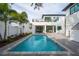 Luxury home with a refreshing blue pool in the backyard at 2440 Floyd St, Sarasota, FL 34239