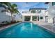 Luxury home with a refreshing blue pool in the backyard at 2440 Floyd St, Sarasota, FL 34239
