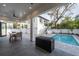Modern patio furniture near the inviting pool and house at 2440 Floyd St, Sarasota, FL 34239