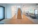 Modern staircase with light wood treads, leading upstairs at 2440 Floyd St, Sarasota, FL 34239