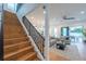 Elegant staircase leading to upper level, view of living room and backyard at 2440 Floyd St, Sarasota, FL 34239