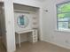 Well-lit bedroom closet with shelves and vanity at 2825 Sequoia Ln, Sarasota, FL 34237