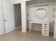 Well-lit bedroom closet with shelves and vanity at 2825 Sequoia Ln, Sarasota, FL 34237