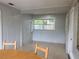 Dining area with wood table and chairs and a window at 2825 Sequoia Ln, Sarasota, FL 34237