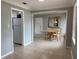 View of dining area and kitchen with white appliances at 2825 Sequoia Ln, Sarasota, FL 34237