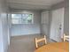 Dining area with wood table and chairs and a window at 2825 Sequoia Ln, Sarasota, FL 34237