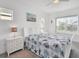 Bright bedroom featuring a white bed frame and serene decor at 5415 Limelight Dr, Apollo Beach, FL 33572