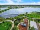 Aerial view of a community with lake, playground and walking paths at 5415 Limelight Dr, Apollo Beach, FL 33572