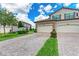 Three-car garage townhome with paver driveway and landscaping at 5922 Wake Forest Run # 101, Bradenton, FL 34211