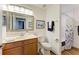 Clean bathroom with shower/tub combo and wood vanity at 7607 Grand Estuary Trl # 205, Bradenton, FL 34212