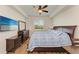 Bedroom with king bed, dresser, and large window at 7607 Grand Estuary Trl # 205, Bradenton, FL 34212