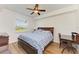 Spacious bedroom with king bed, desk, and window view at 7607 Grand Estuary Trl # 205, Bradenton, FL 34212