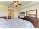 King bedroom with TV and ample storage at 7607 Grand Estuary Trl # 205, Bradenton, FL 34212